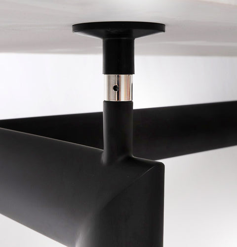  Detail of dining table hardware connecting black metal base to Carrara marble top from below.