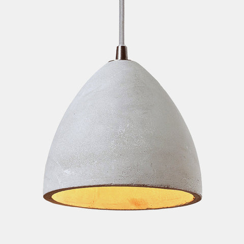 detail of concrete shade on 3 light pendant