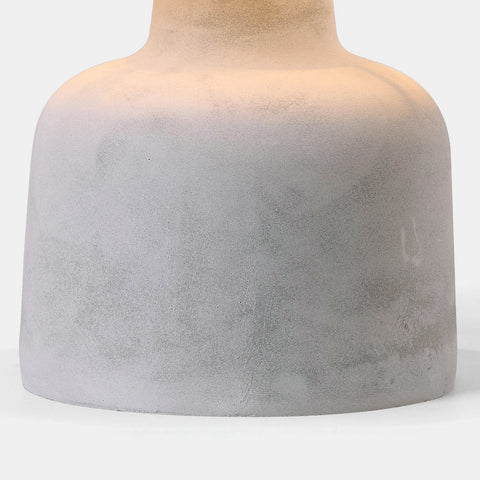 modern table lamp with concrete base and dark grey fabric drum shade. detail of base.