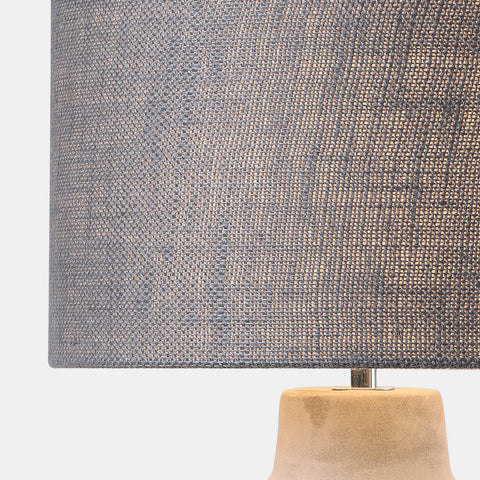 modern table lamp with concrete base and dark grey fabric drum shade. detail of shade