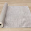 Aspen Woven Rug - Taupe & Black roll on floor