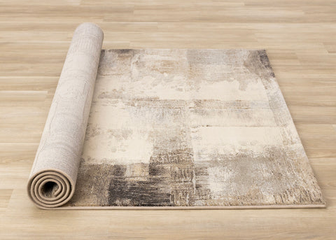 Aurora Distressed Rug - Cream Brown roll on floor