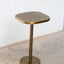 Multipurpose space saving cast aluminum side table in textured brass finish