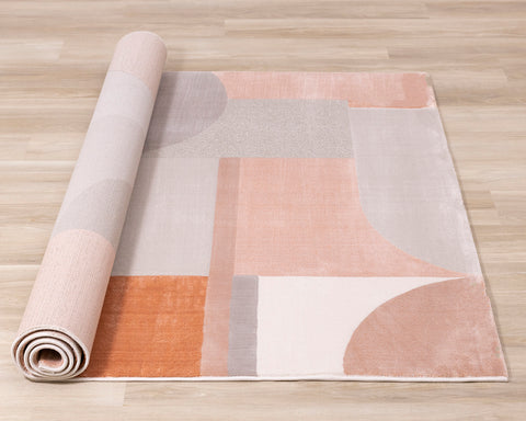  Belle Plush Rug - Pink / Grey Geometric Pattern roll on floor