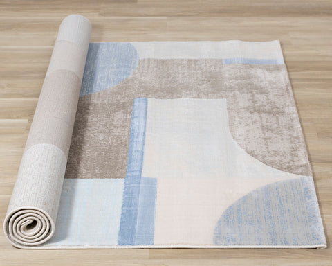 Belle Plush Rug - Blue / Grey Geometric Pattern roll on floor