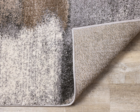 Breeze Rug - Grey & Brown Patches corner flipped to show underside