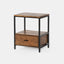 Solid acacia wood nightstand in honey brown finish with industrial black metal frame.