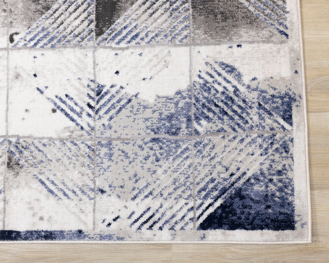 Chorus Distressed Rug - Blue & Grey Triangles corner