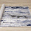 Chorus Distressed Rug - Blue & Grey Triangles roll on floor