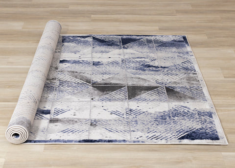 Chorus Distressed Rug - Blue & Grey Triangles roll on floor