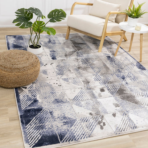 Chorus Distressed Rug - Blue & Grey Triangles in living room setting