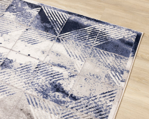 Chorus Distressed Rug - Blue & Grey Triangles croner detail