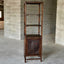 Solid reclaimed mango wood bookcase in dark brown finish.