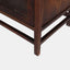 Solid reclaimed mango wood bookcase in dark brown finish. Detail of feet.