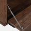 Solid acacia wood media cabinet in charcoal brown finish. Door opened showing hinge that opens door downward.