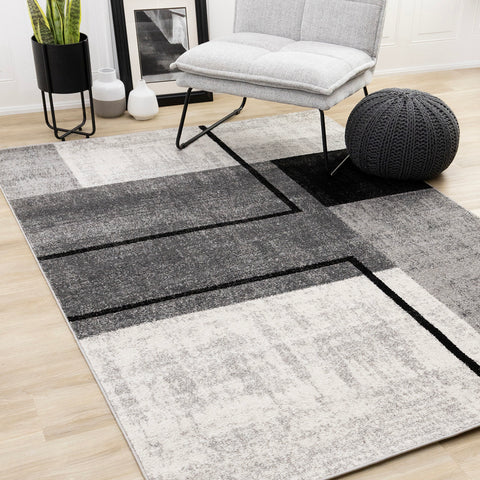 Eclipse Rug - Modern Geometric Grey in living room setting