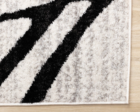 Eclipse Rug - Black Swirls corner detail