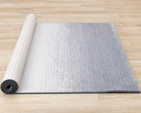  Ella Plush Rug - Blue Cream roll on floor