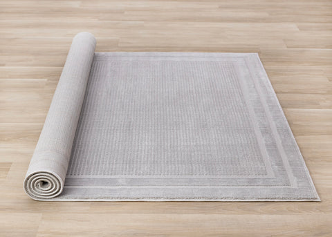 Ellington Rug - Grey Border roll on floor