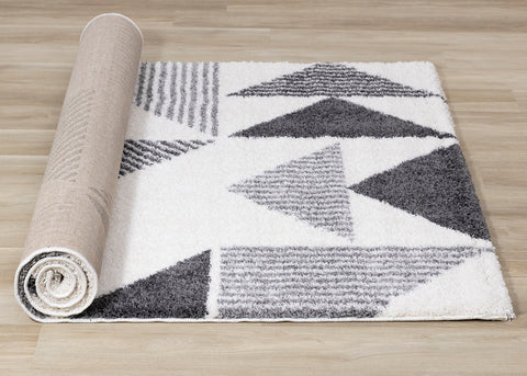 Fergus Shag Rug - Grey Triangles roll on floor