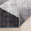 Focus Rug - Grey Faded Triangles corner flipped to show underside