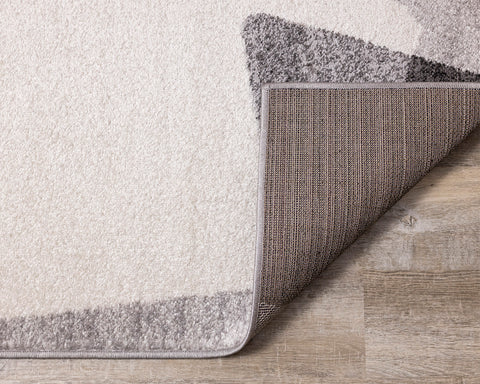 Focus Rug - Grey & White Geometric Shapes corner flipped to show underside