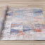 Fresco Distressed Rug - Triangles roll on floor