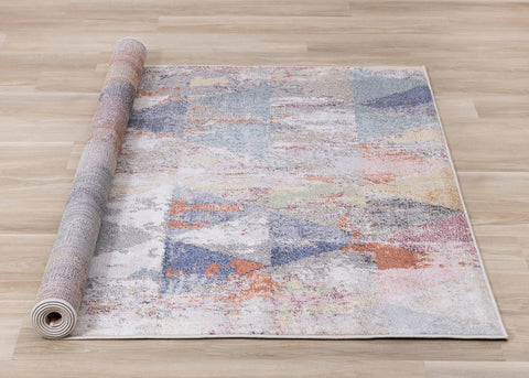 Fresco Distressed Rug - Triangles roll on floor