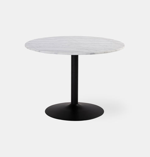 Round dining table with white marble top and black metal pedestal base.