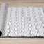  Ice Rug - White & Black Interlocking roll on floor.