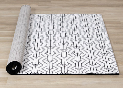  Ice Rug - White & Black Interlocking roll on floor.