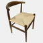 Solid ash wood dining chair with curved back and woven natural cord seat.