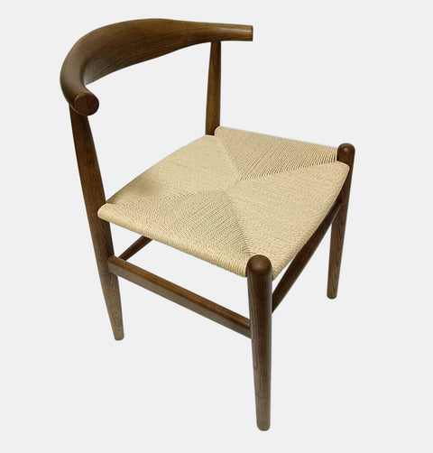 Solid ash wood dining chair with curved back and woven natural cord seat.