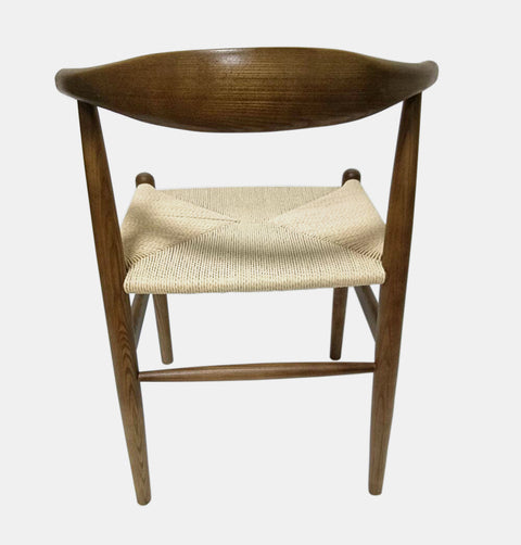 Solid ash wood dining chair with curved back and woven natural cord seat.