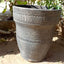 Grey terracotta vase with wide opening.