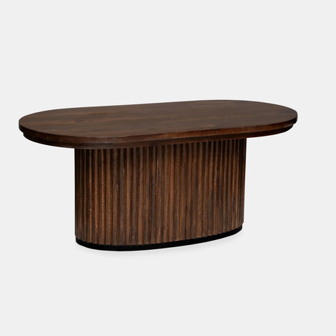 Solid mango wood oblong coffee table with repeating pattern ribbing base in brown finish.