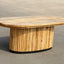 Solid mango wood oblong coffee table with repeating pattern ribbing base in natural finish.