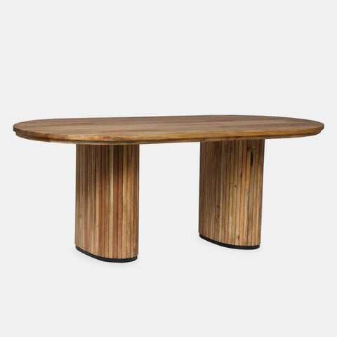 Solid mango wood oblong dining table with 2 repeating pattern ribbed legs in natural finish.