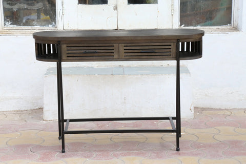 Console table in solid mango wood in dark olive finish with black metal legs and frame.