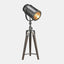 photographer tripod lamp in antique bronze finish with dark brown wood legs.