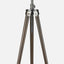 Photographer floor lamp with wooden tripod base, and antique brass finish. tripod base detail.