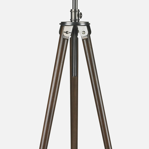 Photographer floor lamp with wooden tripod base, and antique brass finish. tripod base detail.