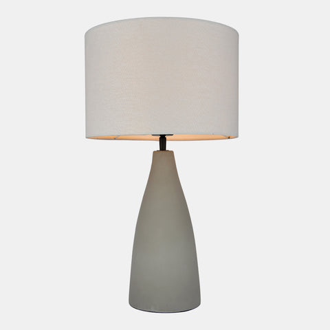 Concrete base table lamp with white linen shade.