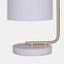 Table lamp with marble base, gold arm, and white shade view of base detail