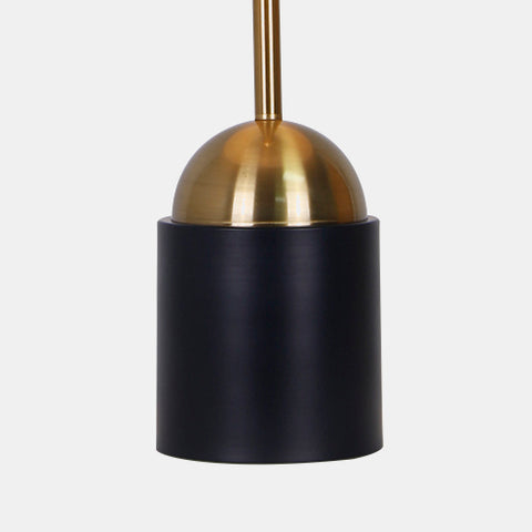 Matte Black and brass table lamp with white linen shade, detail of base