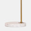 retro inspired table lamp. white linen shade with industrial gold metal arm on white marble base. detail of base.