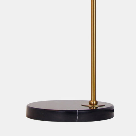 retro inspired table lamp. Brown linen shade with industrial gold metal arm on black marble base. detail of base