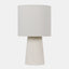  Table lamp with off-white drum shade and white quartz base.