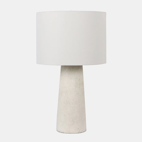 Table lamp with off-white drum shade and white quartz base.