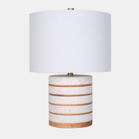 Ceramic and wood base table lamp with white linen drum shade.